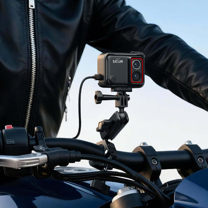 Motorcycle Waterproof Charging Kit for SJ30 mounted on motorcycle handlebars with rider in background